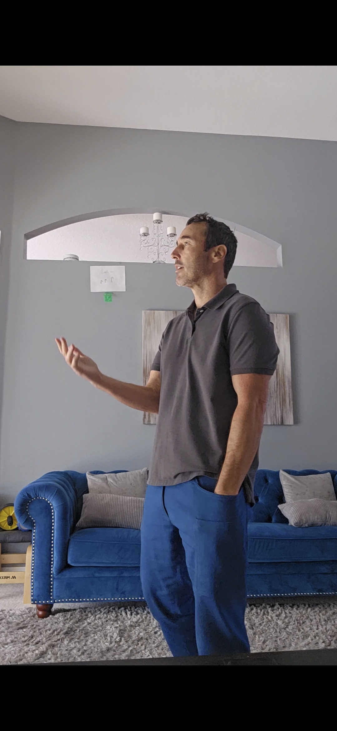 Hand resting naturally at the outer thigh beside the pocket opening