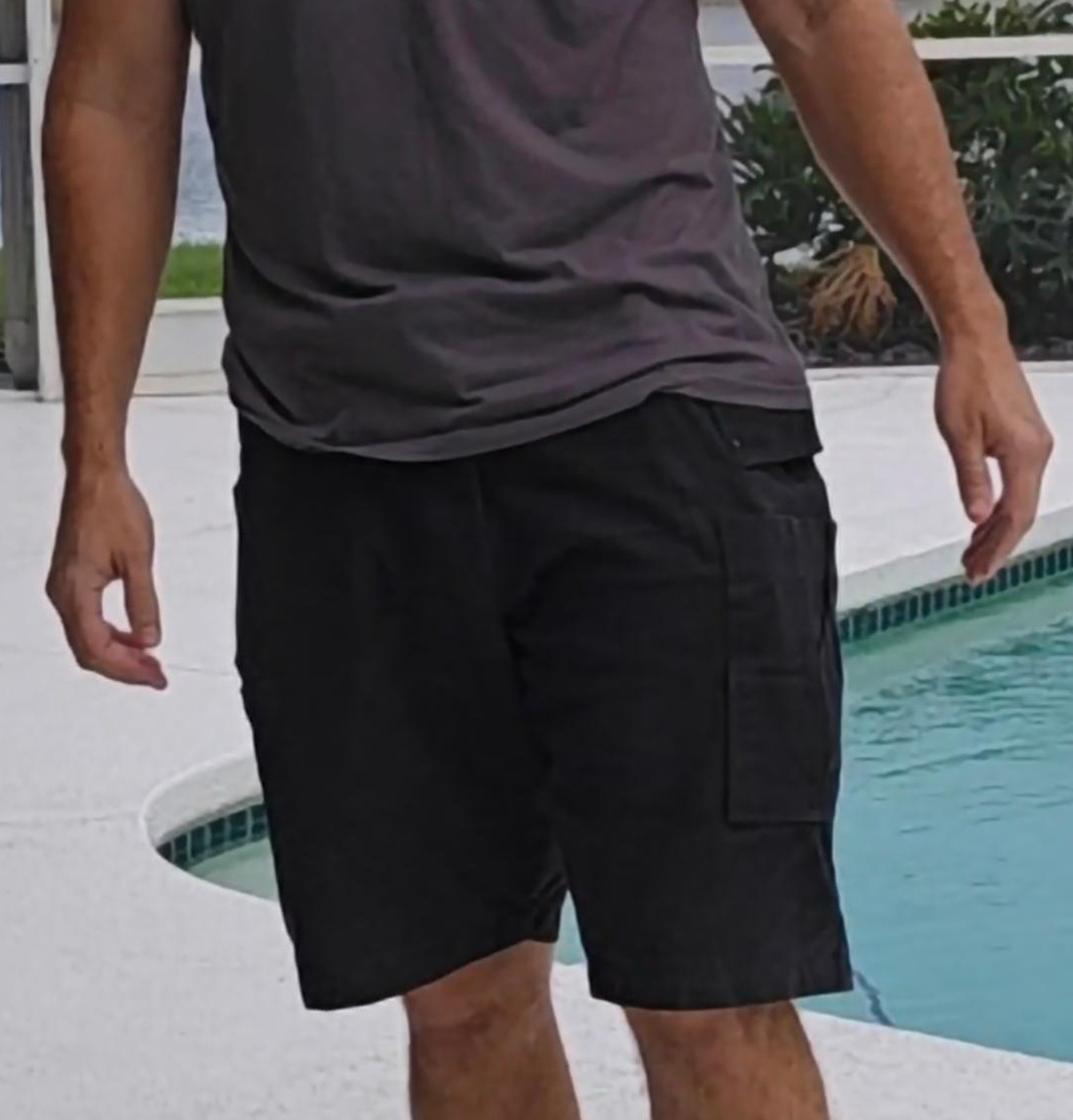 Gunpant men's concealed carry shorts in black, side view showing the leg pocket.