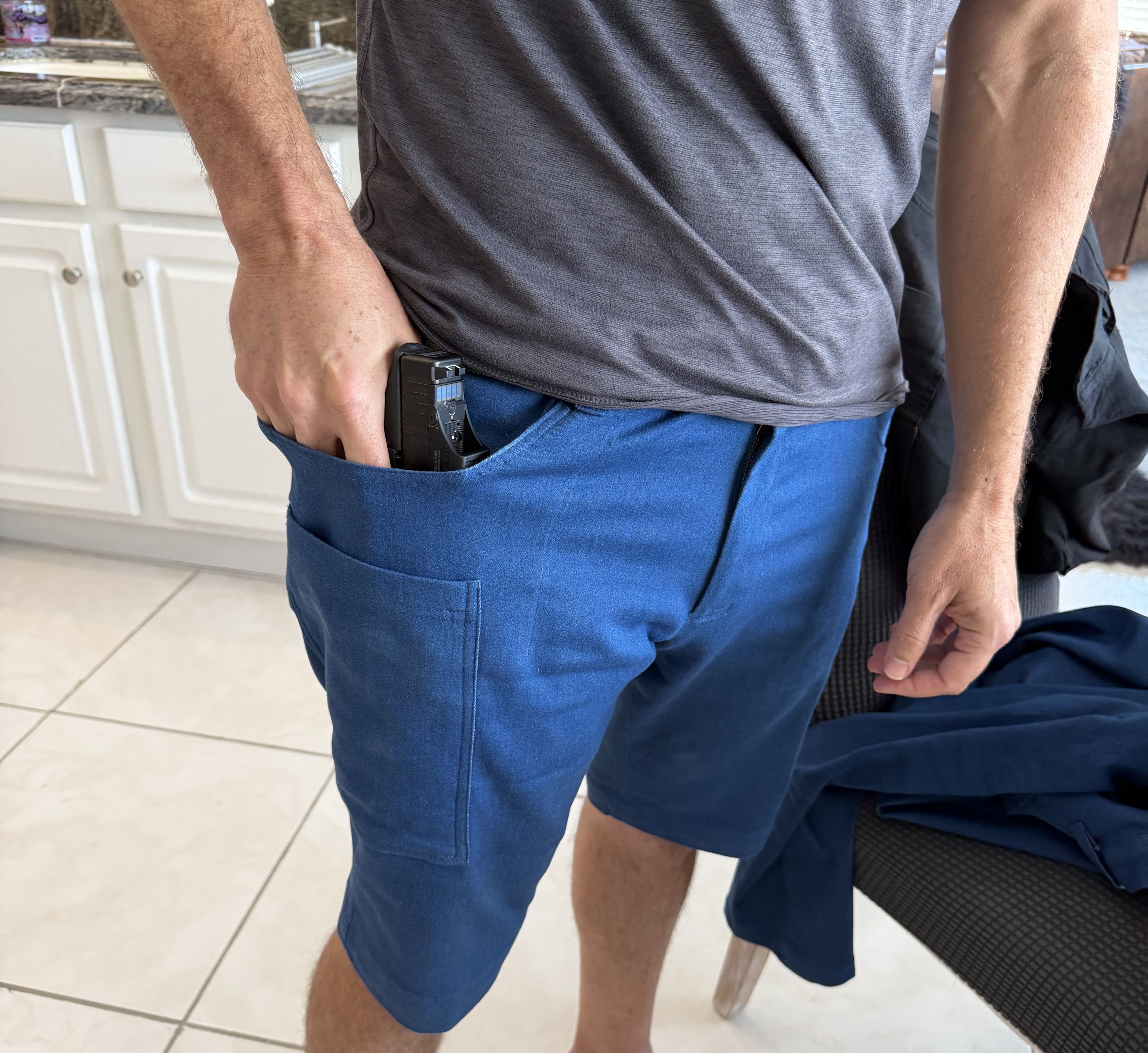 Gunpant side-leg pocket positioned along the outer thigh seam